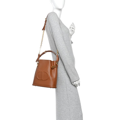Calfskin CD Embossed Medium C'est Chain Bucket Bag Golden Saddle