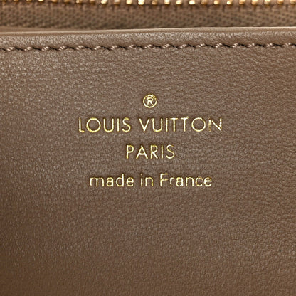 Lambskin Embossed Monogram Coussin Zippy Wallet Taupe