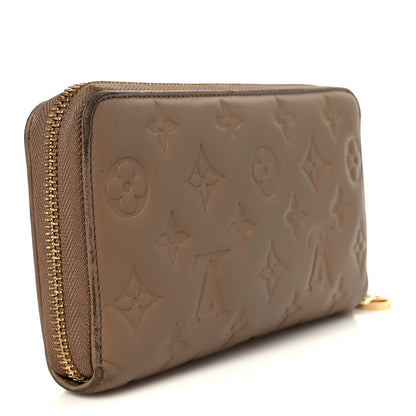 Lambskin Embossed Monogram Coussin Zippy Wallet Taupe