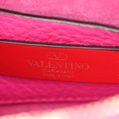 Pebbled Calfskin Small Rockstud Flip Lock Shoulder Bag Fuxia