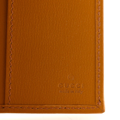 GG Supreme Monogram Textured Calfskin Retro Interlocking G Passport Case Beige Yellow